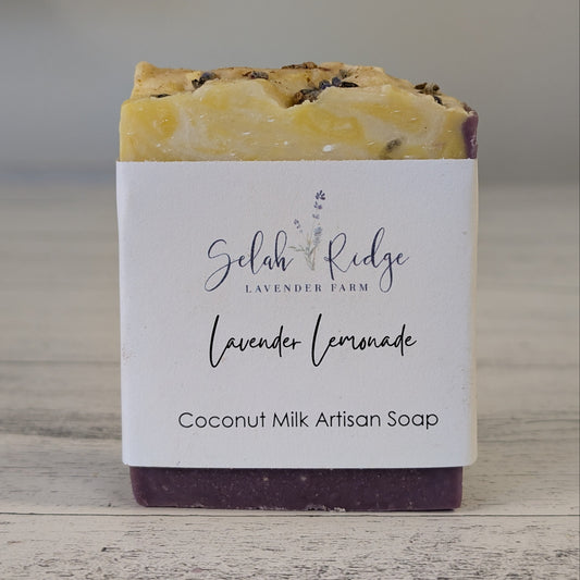 Coconut milk artisan soap with a label on a wooden surface